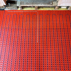 Close up of underfloor heating cable installed in decoupling membrane with thermostat sensor