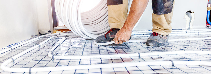 Water underfloor heating pipework installed across an insulated floor